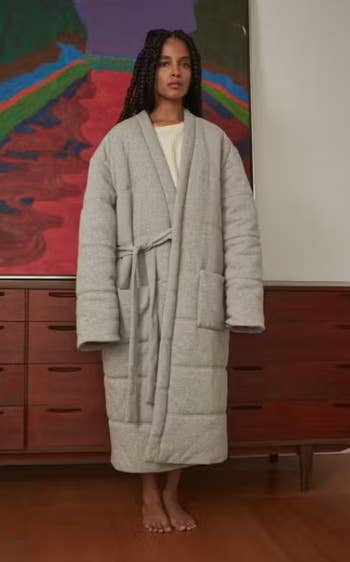 A full-length view of a model wearing the robe