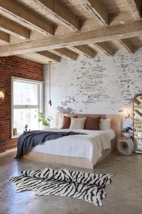 bedroom with faux white tiger hide rug