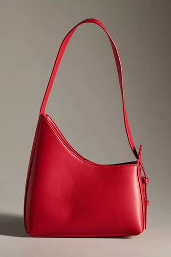 Elegant red shoulder bag with sleek design, ideal for a sophisticated look