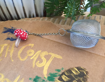 The wire tea strainer with a mushroom attached to the other end