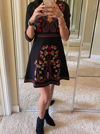 reviewer mirror selfie wearing the dress