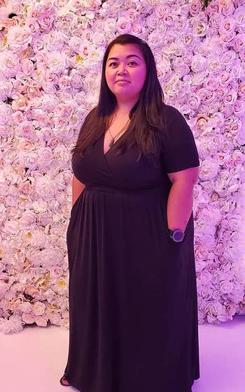 reviewer wearing the black maxi dress