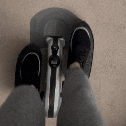 gif of BuzzFeeder pedaling on portable elliptical