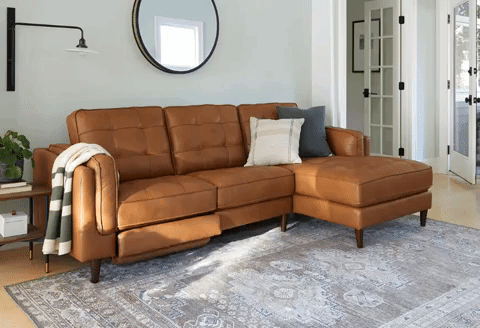 the brown leather couch with power footrest unrolling