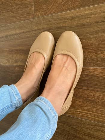 the same reviewer wearing the beige flats