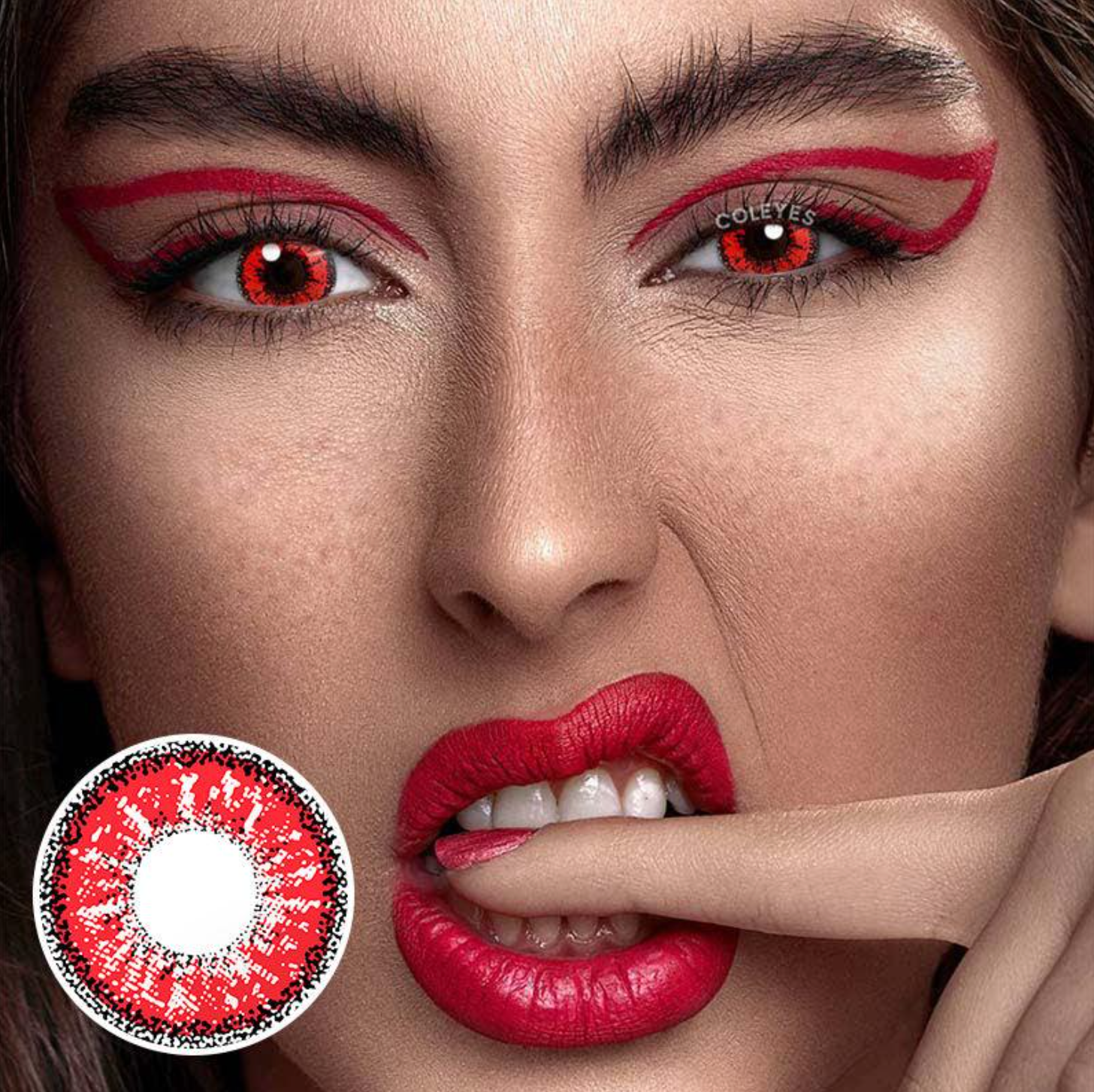 Model with red eyeliner and red lipstick wearing red colored contacts with product in left corner of photo