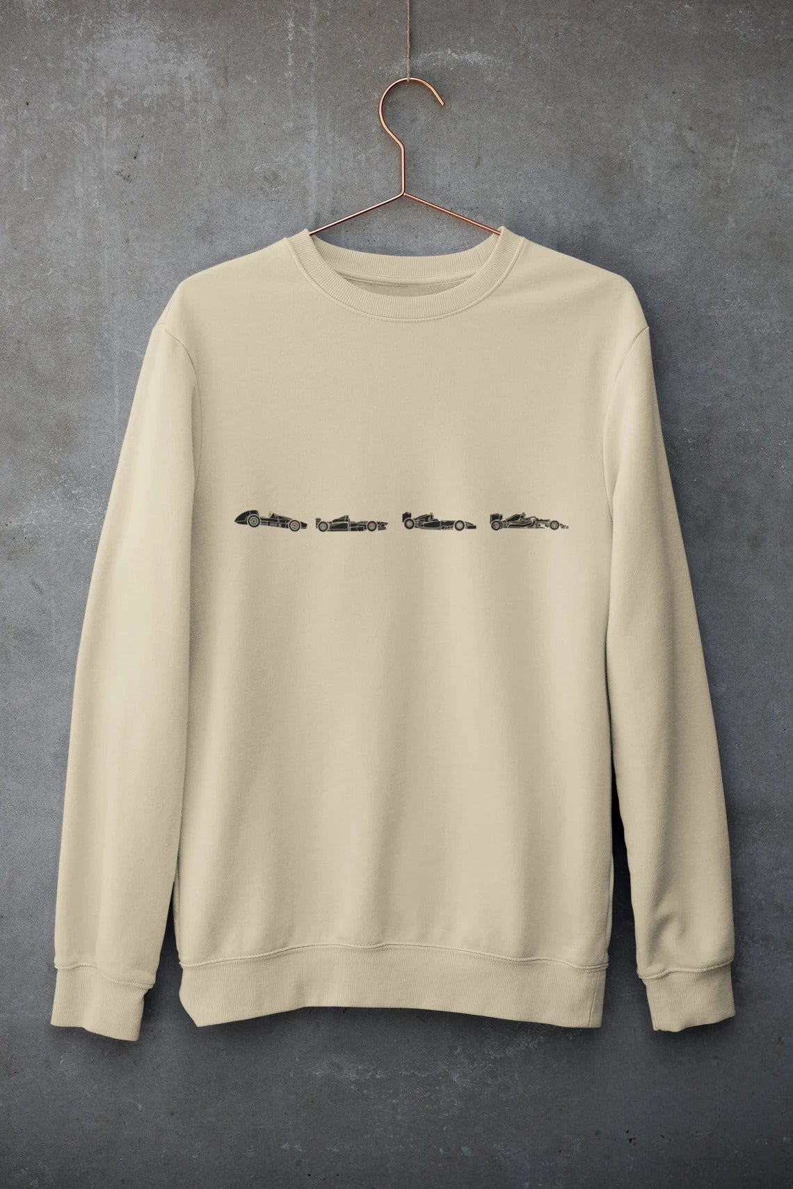 a tan crewneck sweatshirt with four styles of formula 1 car