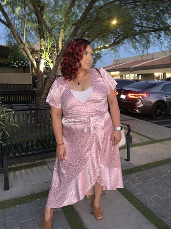 reviewer wearing the dress in pink