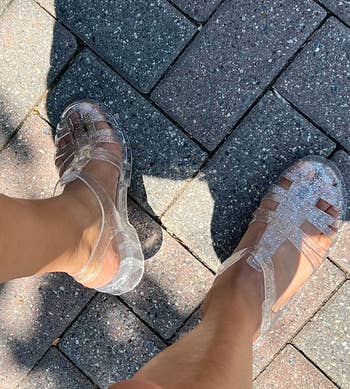 Reviewer wearing clear sandals