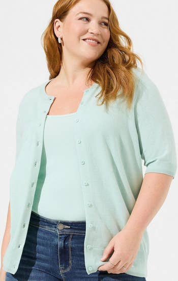 Another model wearing the short sleeve cardigan in mint