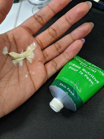 reviewer photo of the product in palm of hand, tube nearby