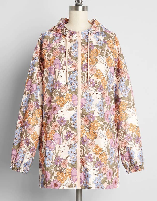a raincoat with soft pastel florals and bunnies