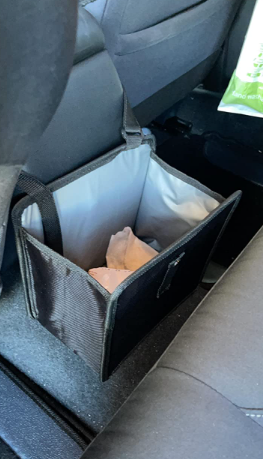 side view of trash can in reviewer's car
