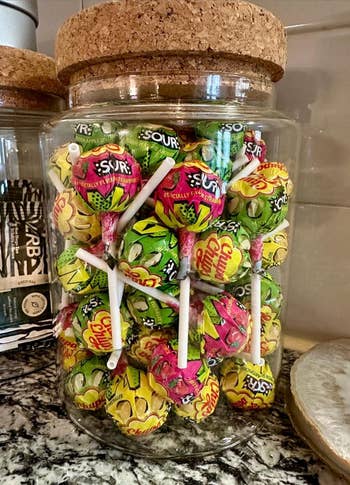 A solid  jar filled with assorted lollipops, showcasing assorted  flavors. Ideal for candy lovers looking to indulge successful  saccharine  and sour treats