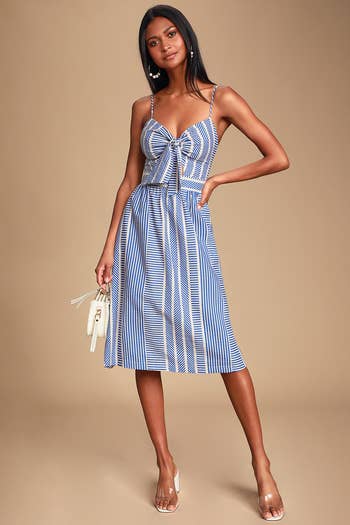 model in white spaghetti strap dress with blue stripes in different angles