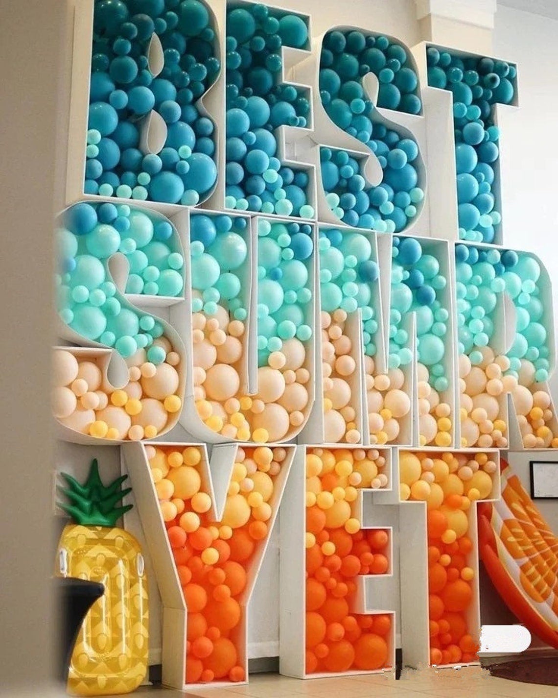 a photo of balloon frames filled with balloons that spell out best summer yet