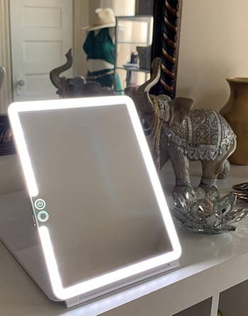 a reviewer photo of the illuminated makeup mirror 