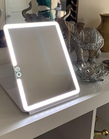 a reviewer photo of the illuminated makeup mirror