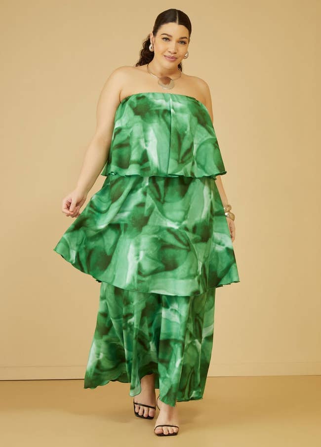model wearing green watercolor tiered maxi dress