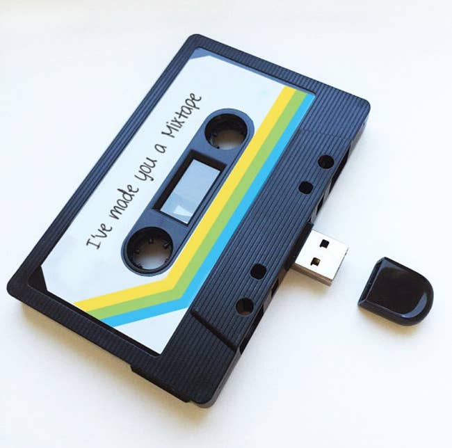 flash drive with base shaped like a cassette tape with text 