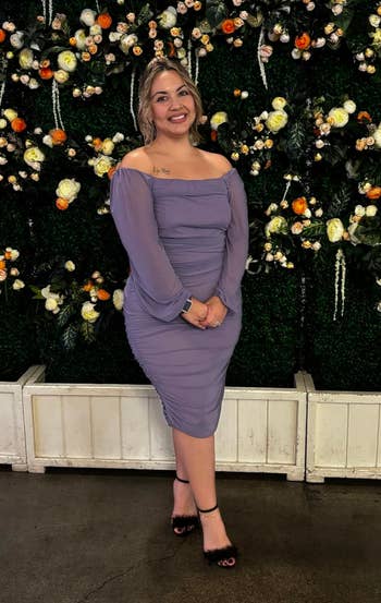 different reviewer in purple puff-sleeve midi dress