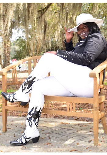 Reviewer wearing product outside in white pants