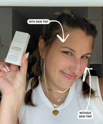 buzzfeed writer ali holding skin tint bottle and showing one half of face with skin tint on and one half without it