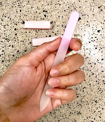reviewer holding nail file