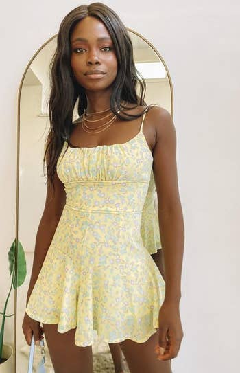 front view of a model in the yellow romper