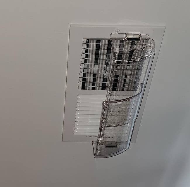 Ceiling aerial vent with a transparent integrative deflector attached, directing airflow