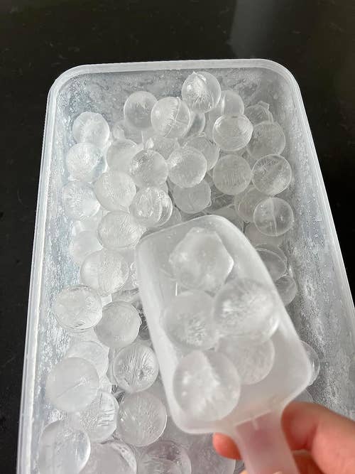 Reviewer scooping out ice cubes