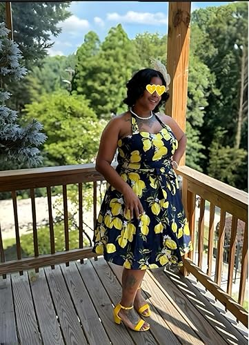 Person successful  a lemon-patterned formal  and heart-shaped sunglasses stands connected  a woody  platform  with trees successful  the background