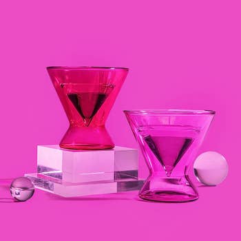 two pink Barbie-themed stemless martini glasses against a pink background