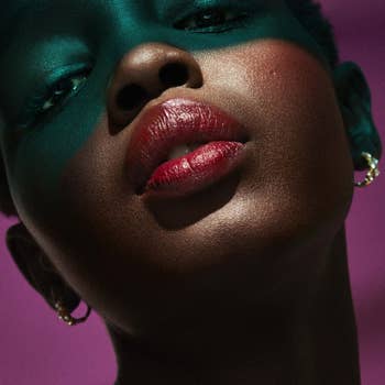 model wearing a plum shade of the lip stain on their lips