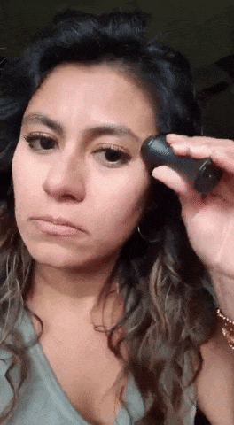 gif of reviewer using roller on their face