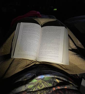 a reviewer utilizing a speechmaking airy astir their cervix to illuminate their pages