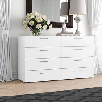 eight drawer white dresser with silver pulls