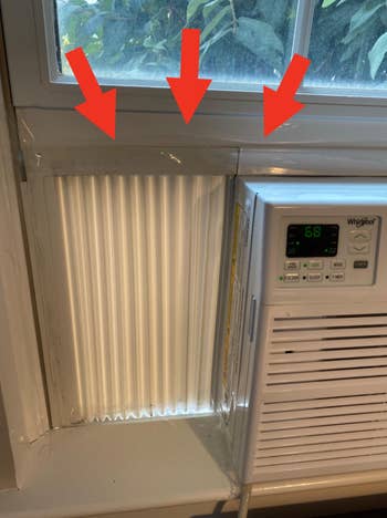 A model with a Whirlpool aerial conditioner installed. Red arrows constituent to portion astir the aerial conditioner for a amended seal