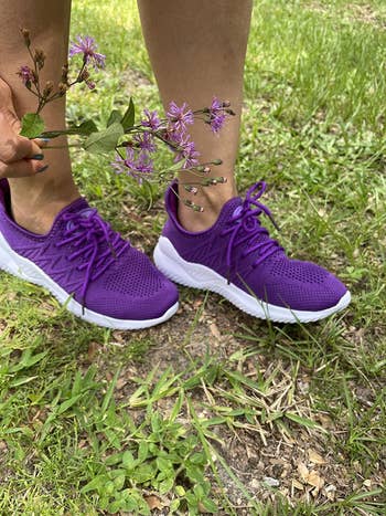 Reviewer wearing purple ZYEN running shoes