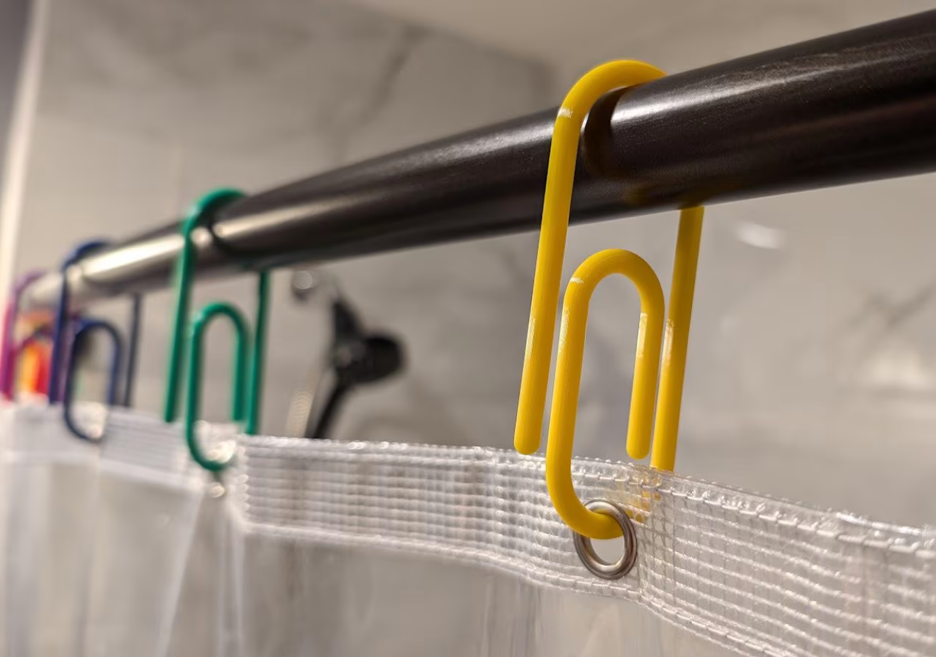 Colorful jumbo paperclips utilized  arsenic  curtain hooks connected  a ablution  rod