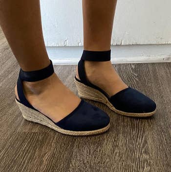 Photo of reviewer wearing navy sandals