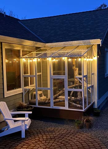 the white catio lit up at night