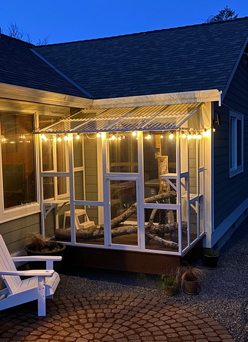 the white catio lit up at night