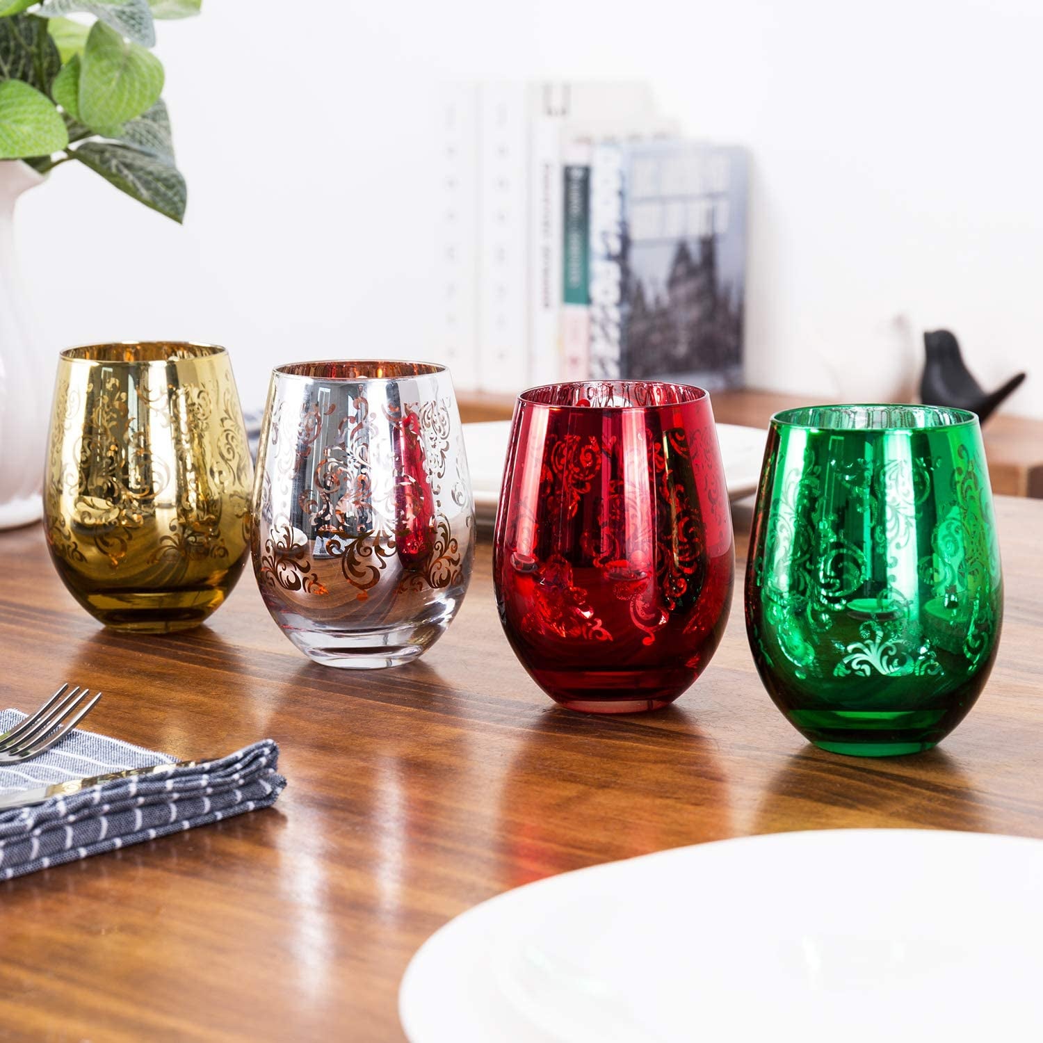 the gold, silver, red, and green stemless wine glasses