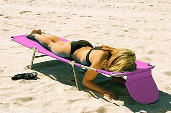 Person relaxing on a beach lounge chair with a sun hat, suitable for an article on beach vacation shopping