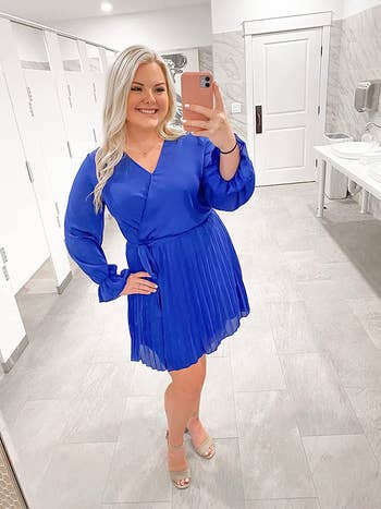 Reviewer wearing the same dress in a royal blue