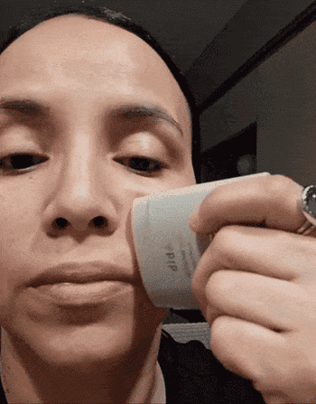 gif of reviewer is applying sunscreen with a contoured balm instrumentality   