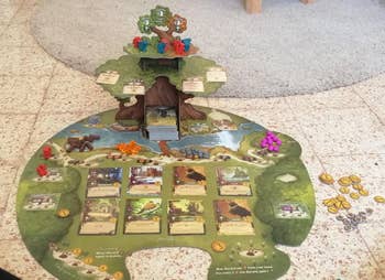 a reviewer photo of the tree-shaped game board and included cards 