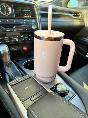 reviewers light pink water bottle in car cup holder