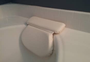 Reviewer's bath pillow suctioned onto their tub